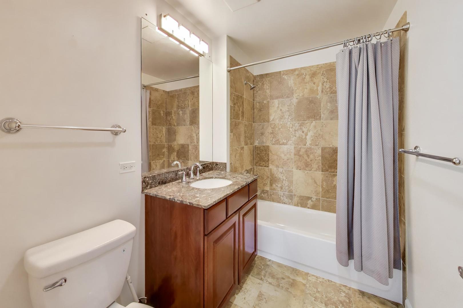 1629 South Prairie Avenue, Unit 1806 Chicago, IL 60616 - Photo 15 of 27 a bathroom with a sink a toilet and shower
