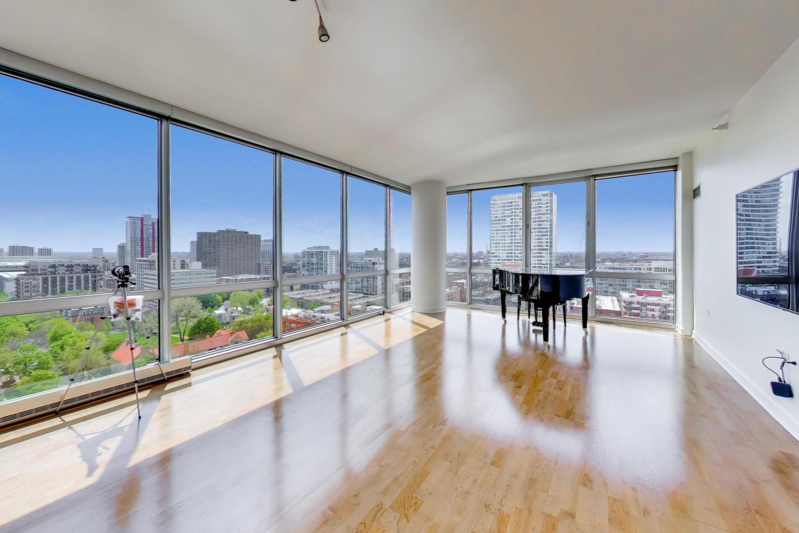 1629 South Prairie Avenue, Unit 1806 Chicago, IL 60616 - Photo 2 of 27 a view of dining room with floor to ceiling window wooden floor and an outdoor view