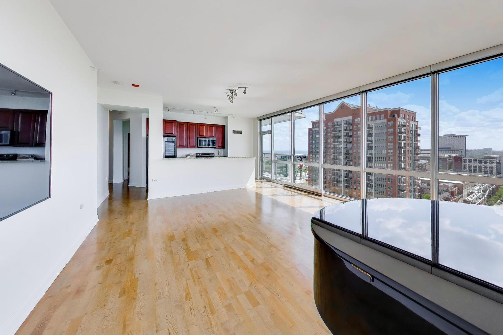 1629 South Prairie Avenue, Unit 1806 Chicago, IL 60616 - Photo 4 of 27 a view of a living room hardwood floor and furniture