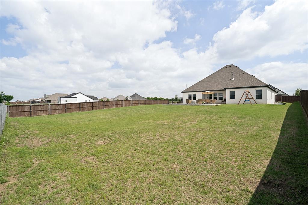 9424 Wildcat Ridge Godley, TX 76044 - Photo 25 of 25 a large body of water with a big yard and large trees