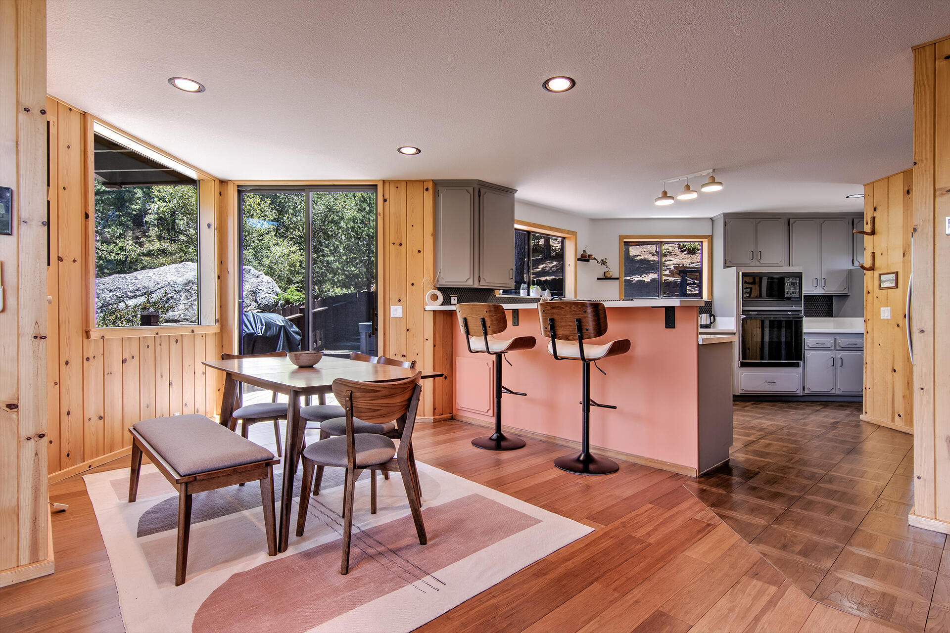 55540 Howland Road Idyllwild, CA 92549 - Photo 11 of 76 a view of a dining room with furniture and wooden floor