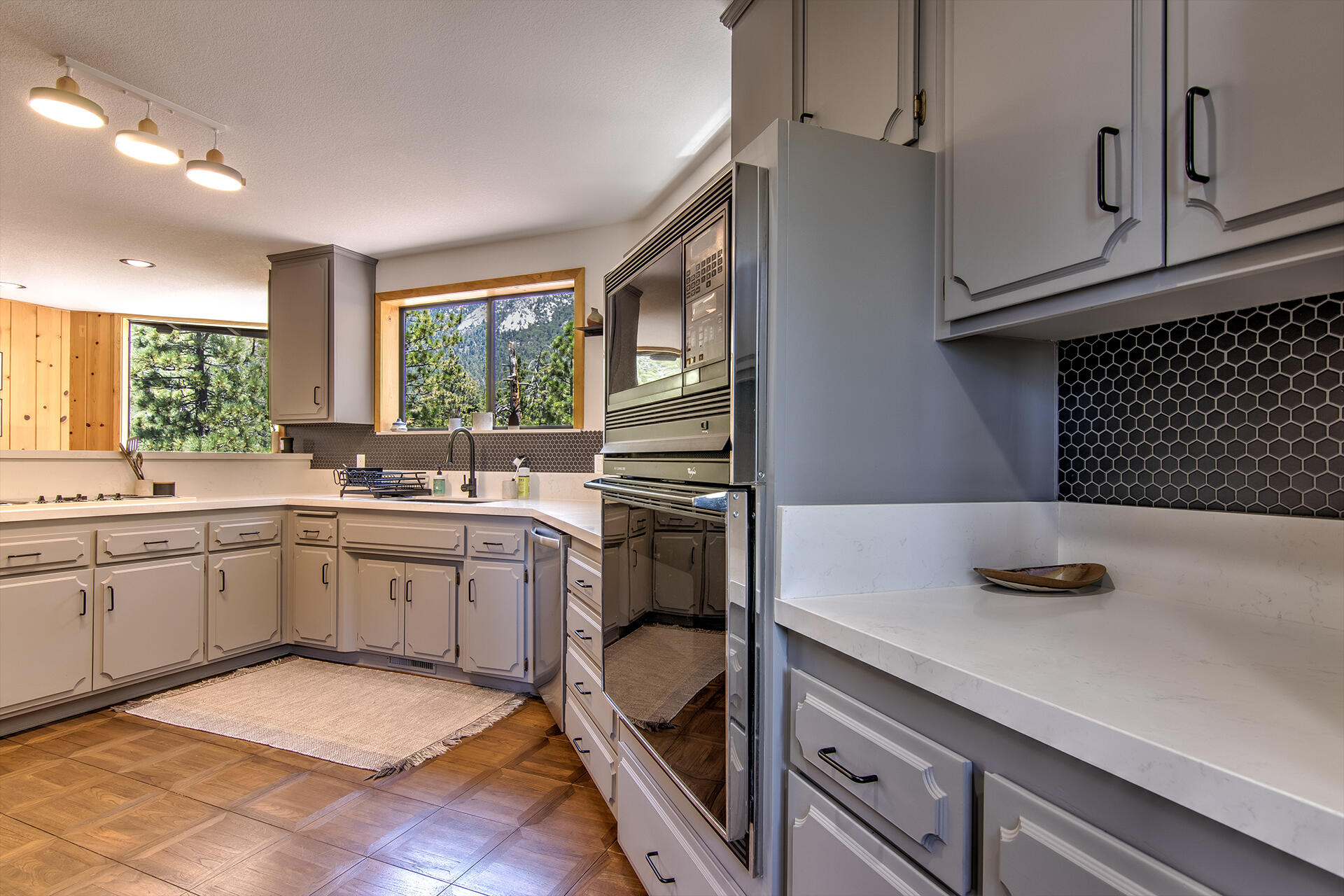 55540 Howland Road Idyllwild, CA 92549 - Photo 14 of 76 a kitchen with a sink stove and cabinets