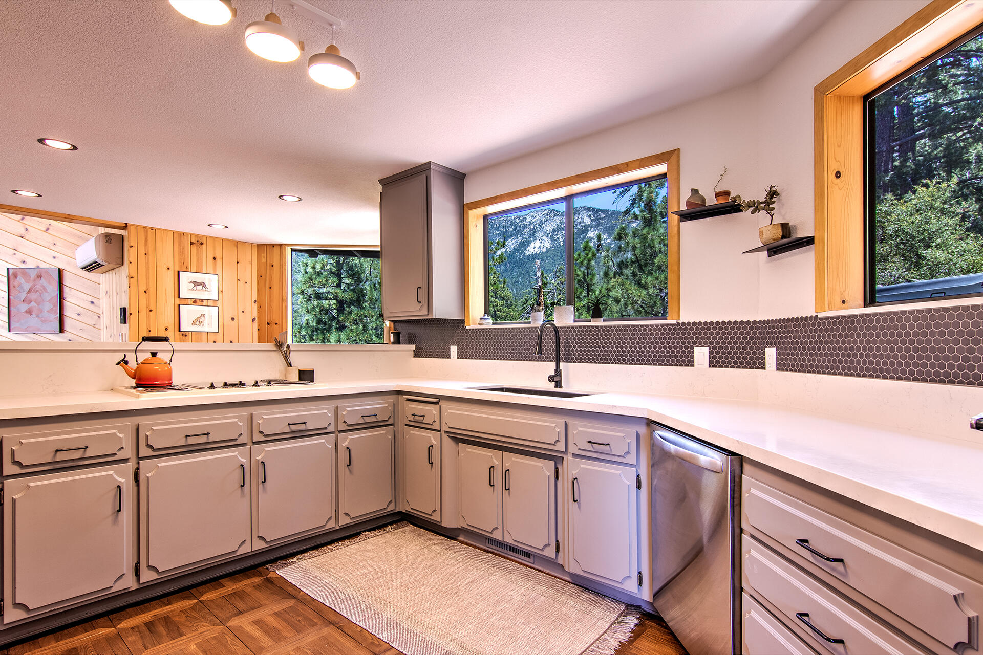 55540 Howland Road Idyllwild, CA 92549 - Photo 17 of 76 a kitchen with sink cabinets and wooden floor