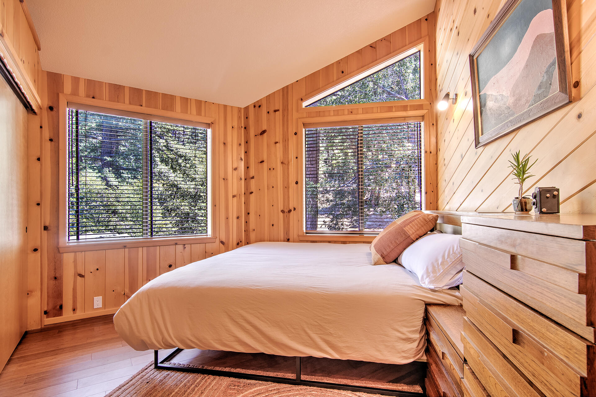 55540 Howland Road Idyllwild, CA 92549 - Photo 25 of 76 a bedroom with a bed and a large window