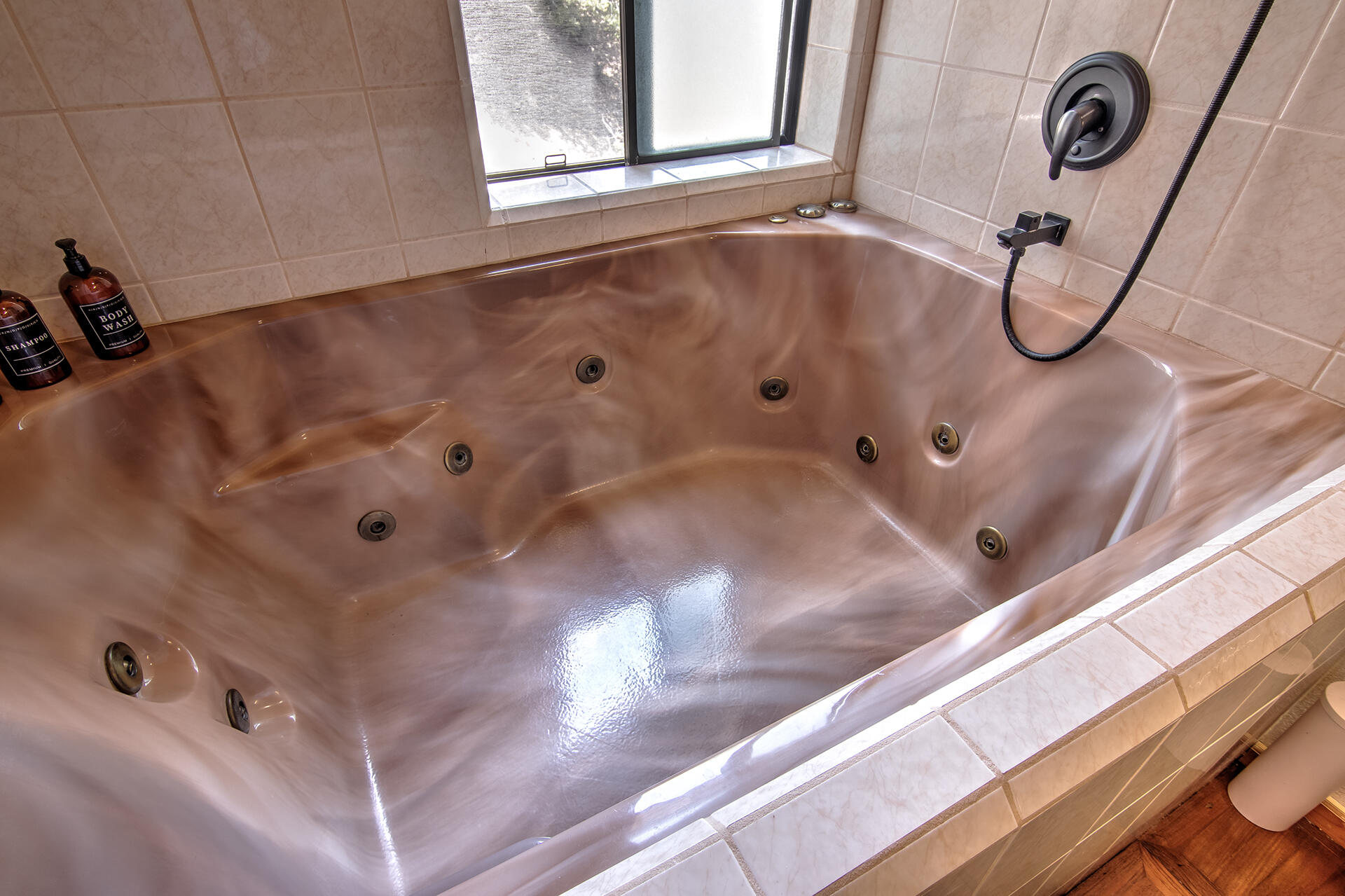 55540 Howland Road Idyllwild, CA 92549 - Photo 30 of 76 a bathroom with a bathtub and shower