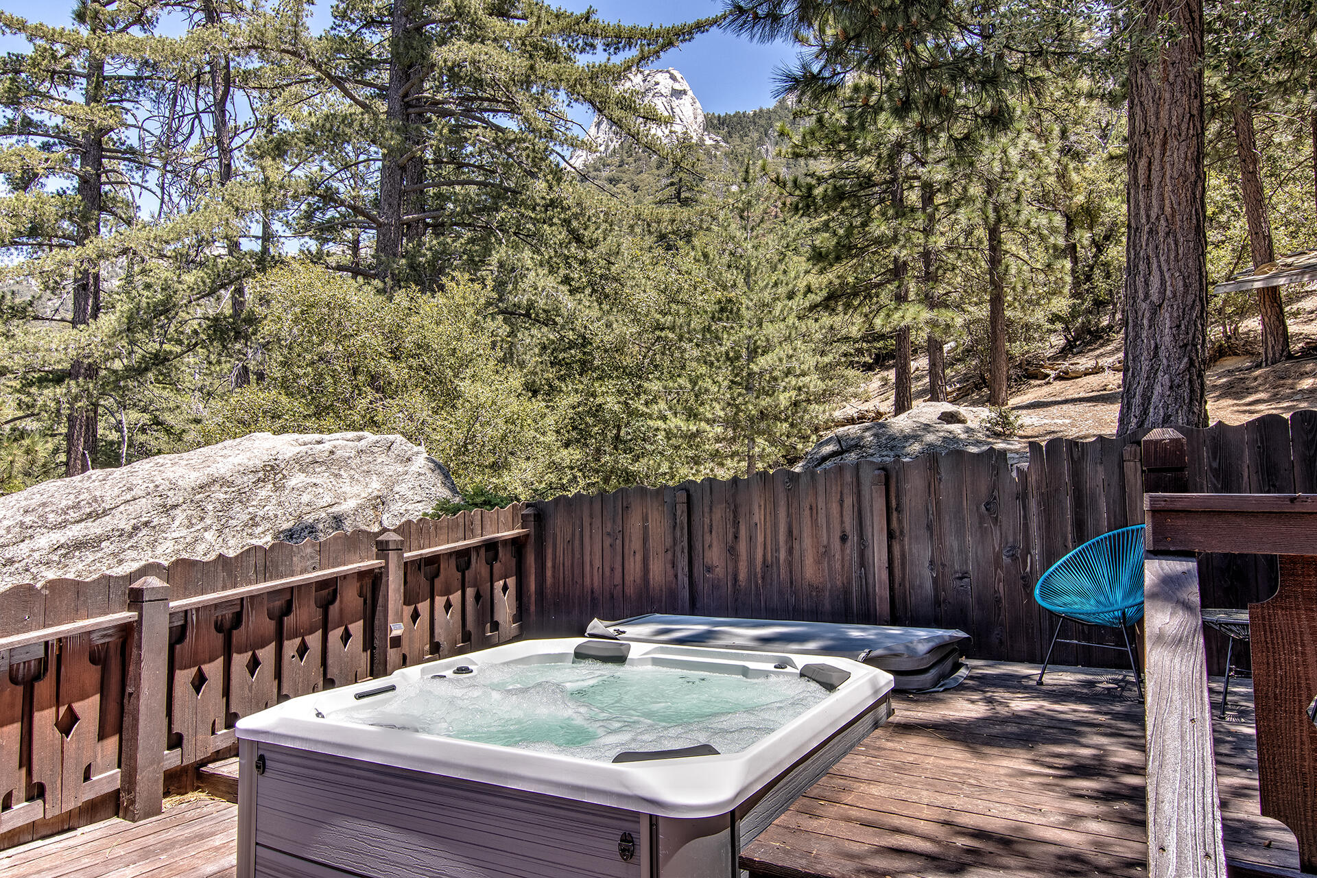 55540 Howland Road Idyllwild, CA 92549 - Photo 41 of 76 a view of a backyard with a small deck and wooden fence
