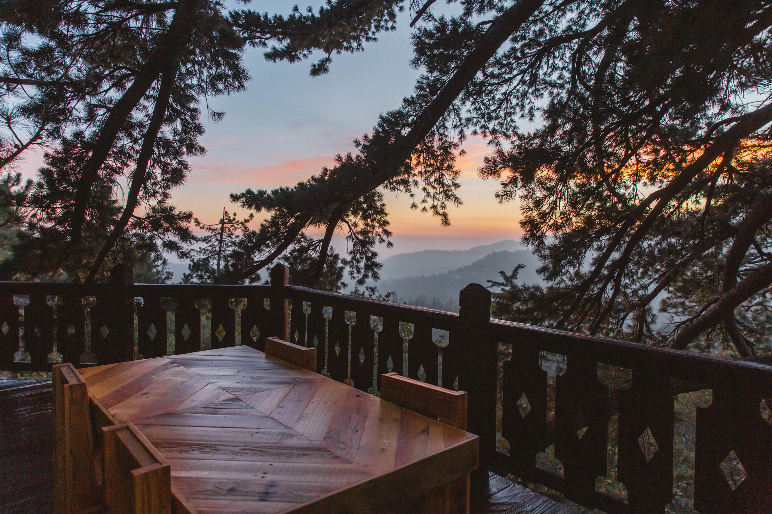 55540 Howland Road Idyllwild, CA 92549 - Photo 51 of 76 a view of a wooden deck and a backyard