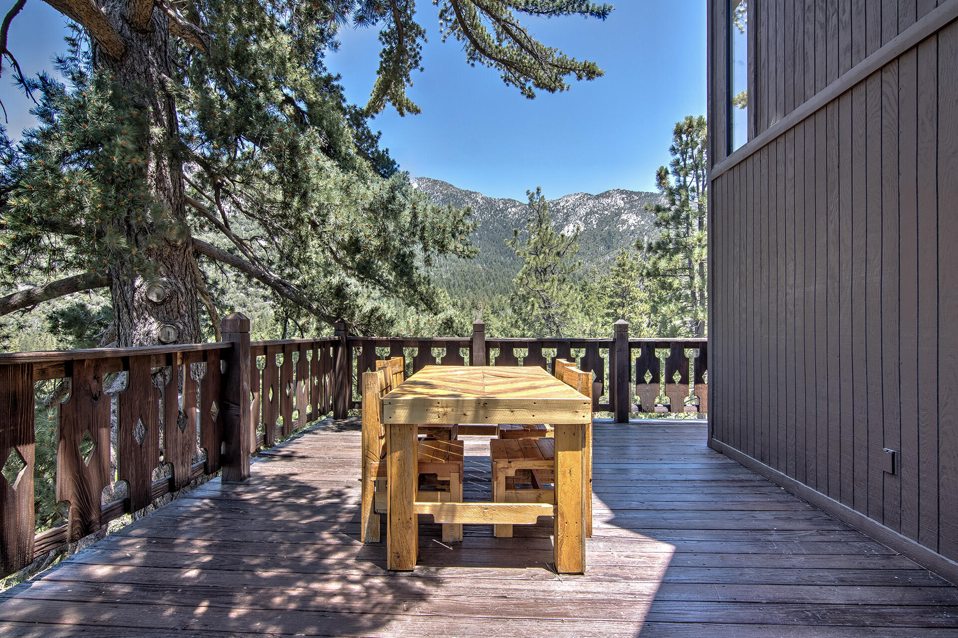 55540 Howland Road Idyllwild, CA 92549 - Photo 52 of 76 a view of balcony with wooden floor and outdoor seating