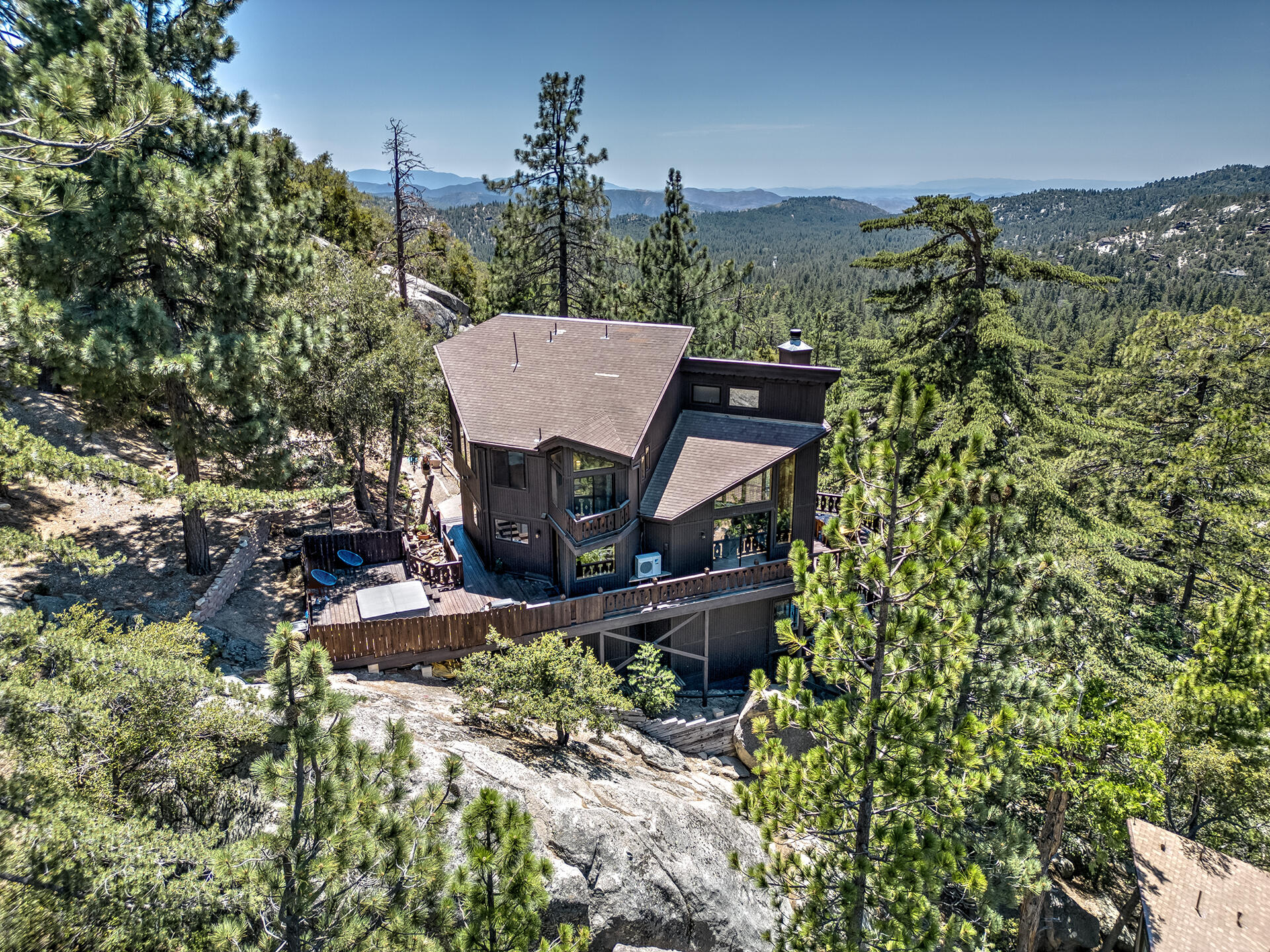 55540 Howland Road Idyllwild, CA 92549 - Photo 61 of 76 a view of a house with a yard and sitting area