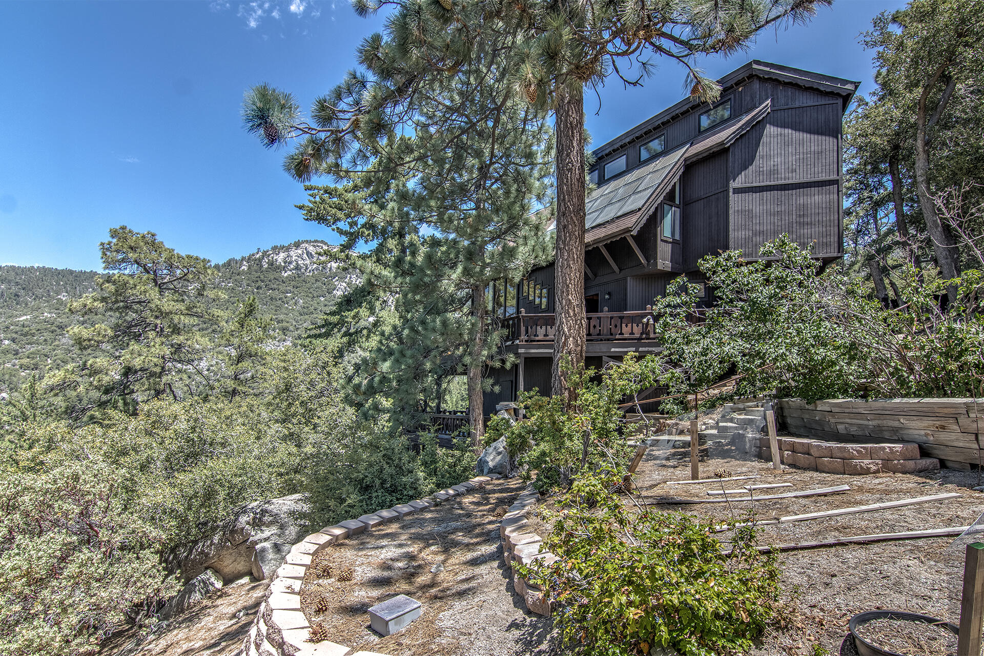 55540 Howland Road Idyllwild, CA 92549 - Photo 65 of 76 a view of a house with a yard and garden