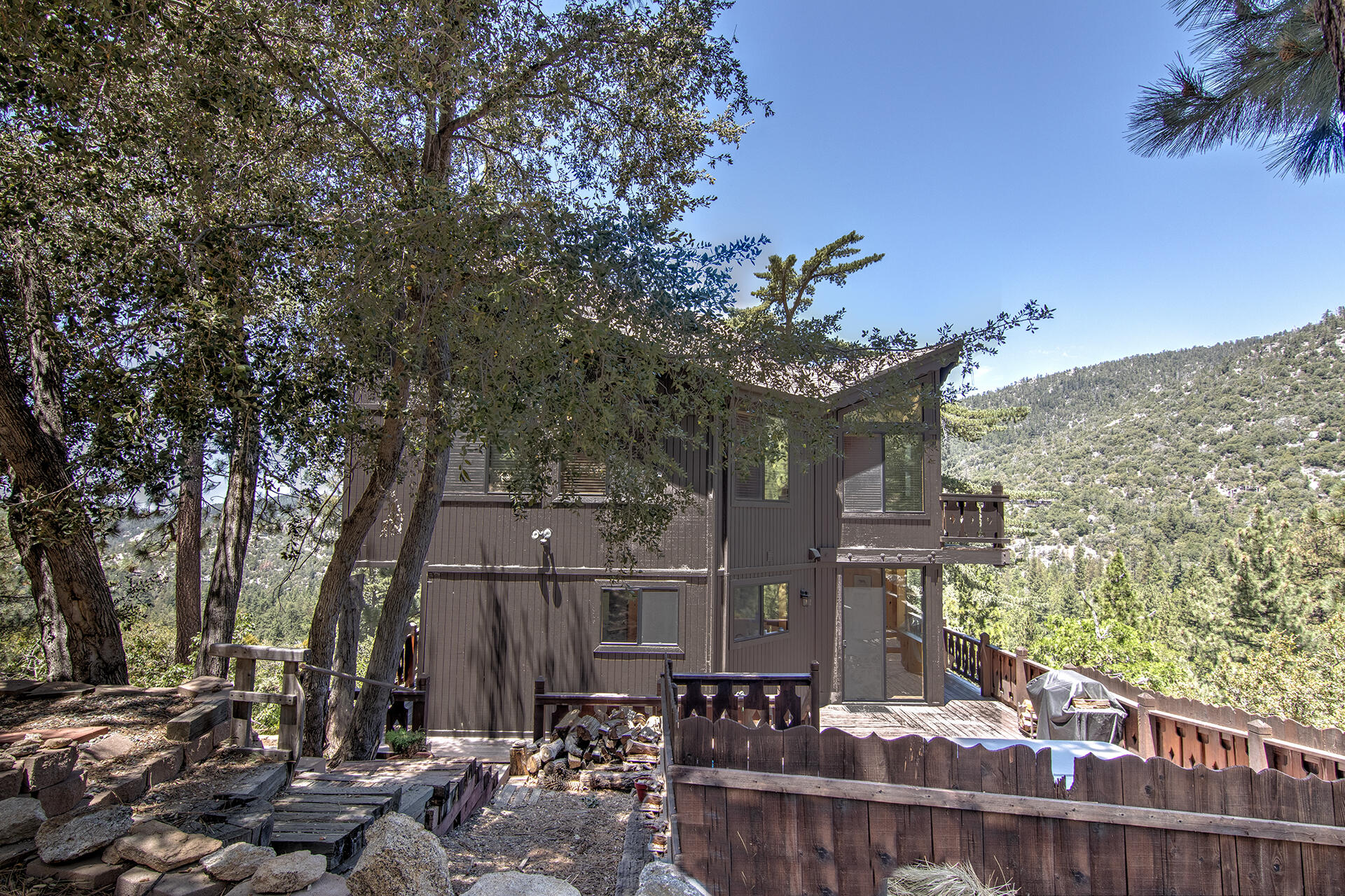 55540 Howland Road Idyllwild, CA 92549 - Photo 68 of 76 a view of a house with a tree in the background