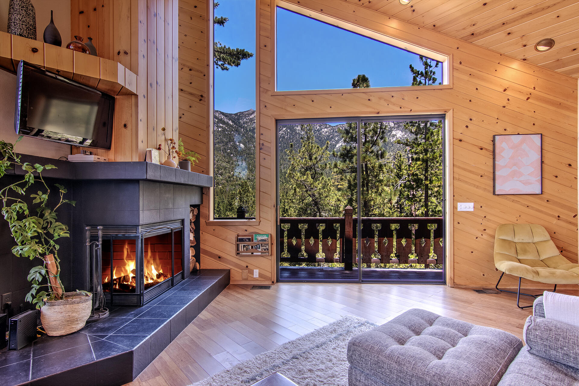 55540 Howland Road Idyllwild, CA 92549 - Photo 8 of 76 a living room with furniture and a fireplace