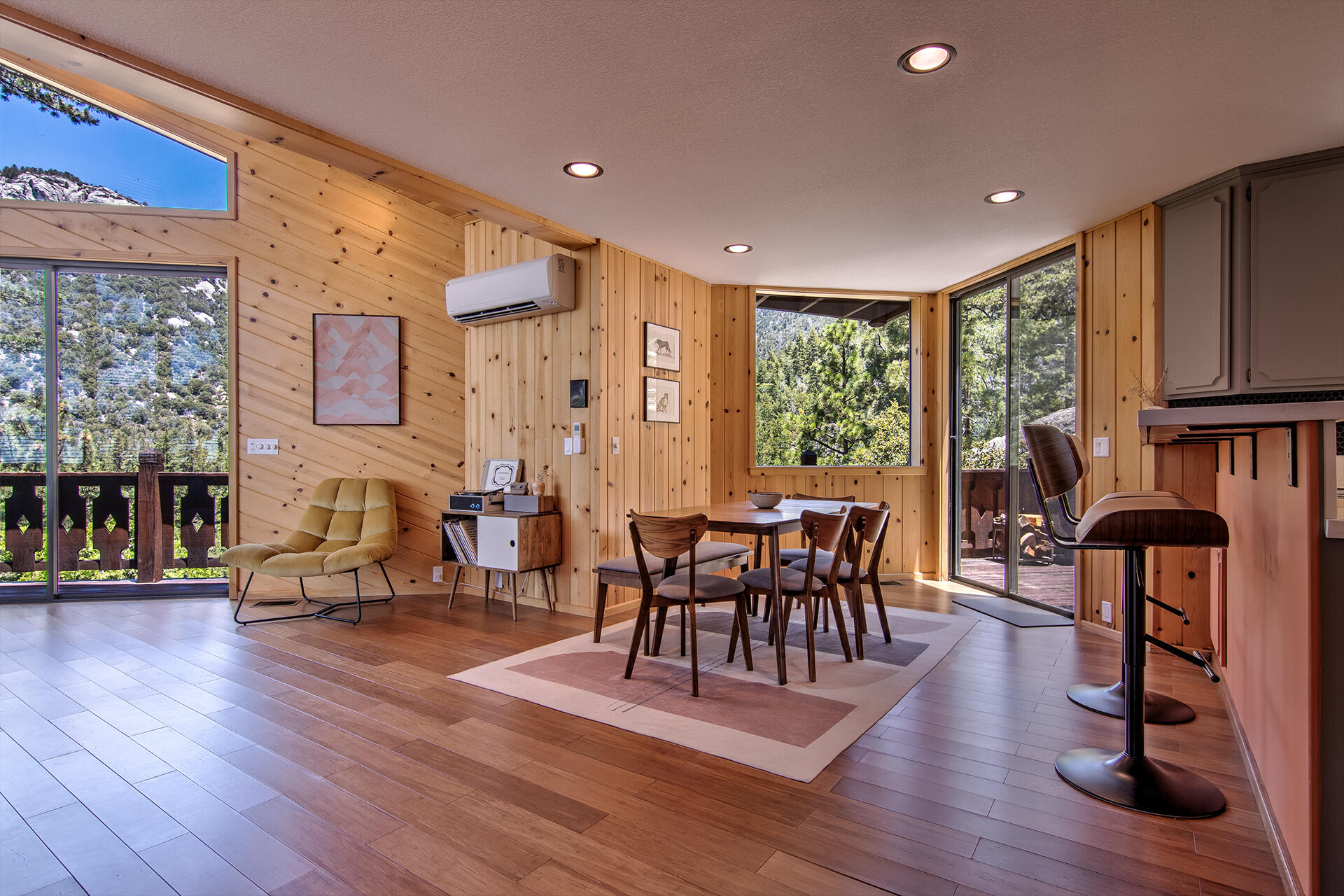 55540 Howland Road Idyllwild, CA 92549 - Photo 9 of 76 a view of a dining room with furniture and wooden floor
