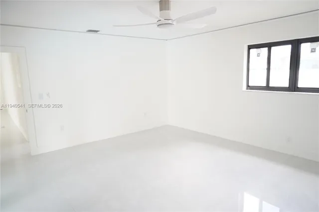 a view of empty room with windows