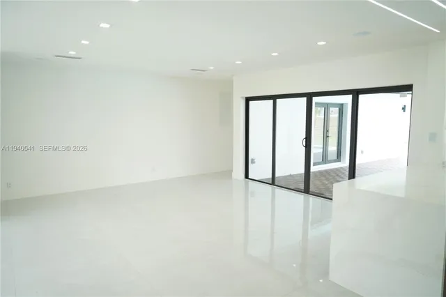 a bathroom with a white toilet and a shower