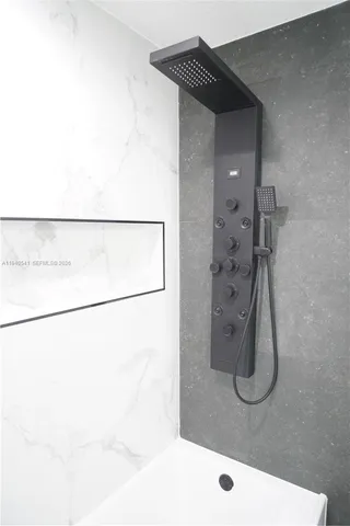 a bathroom with a toilet a sink and a mirror