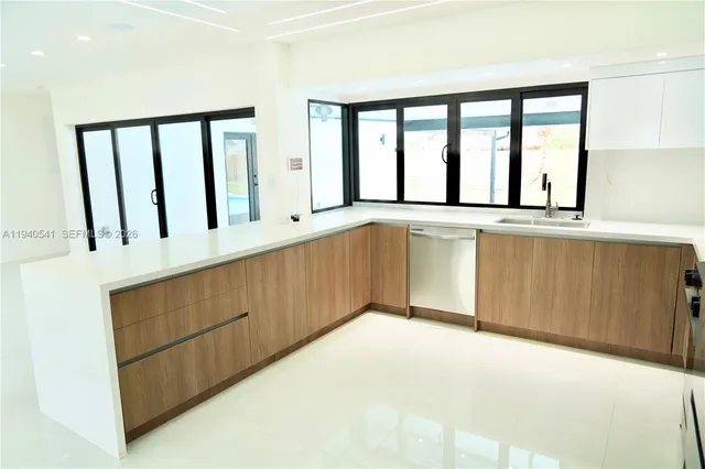 a view of a kitchen with an outdoor space