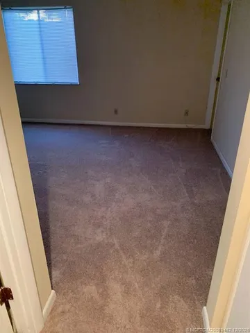 a bathroom with a shower and a sink