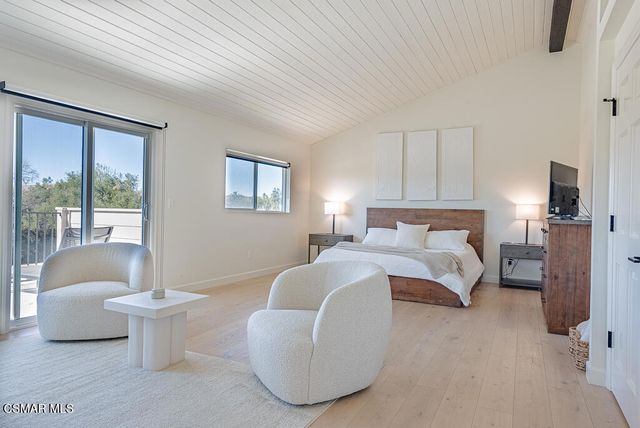 a bed room with a bed and a couch