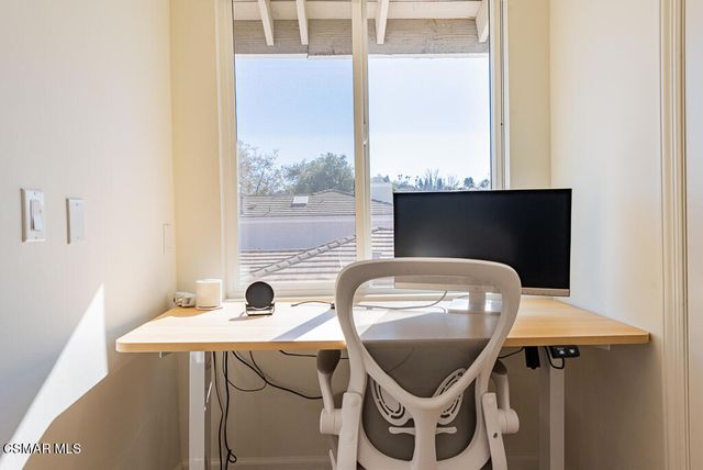 a front view of a house with a table and chairs