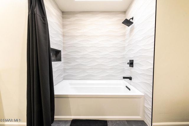 a bathroom with a bathtub