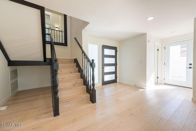 a view of entryway with stairs