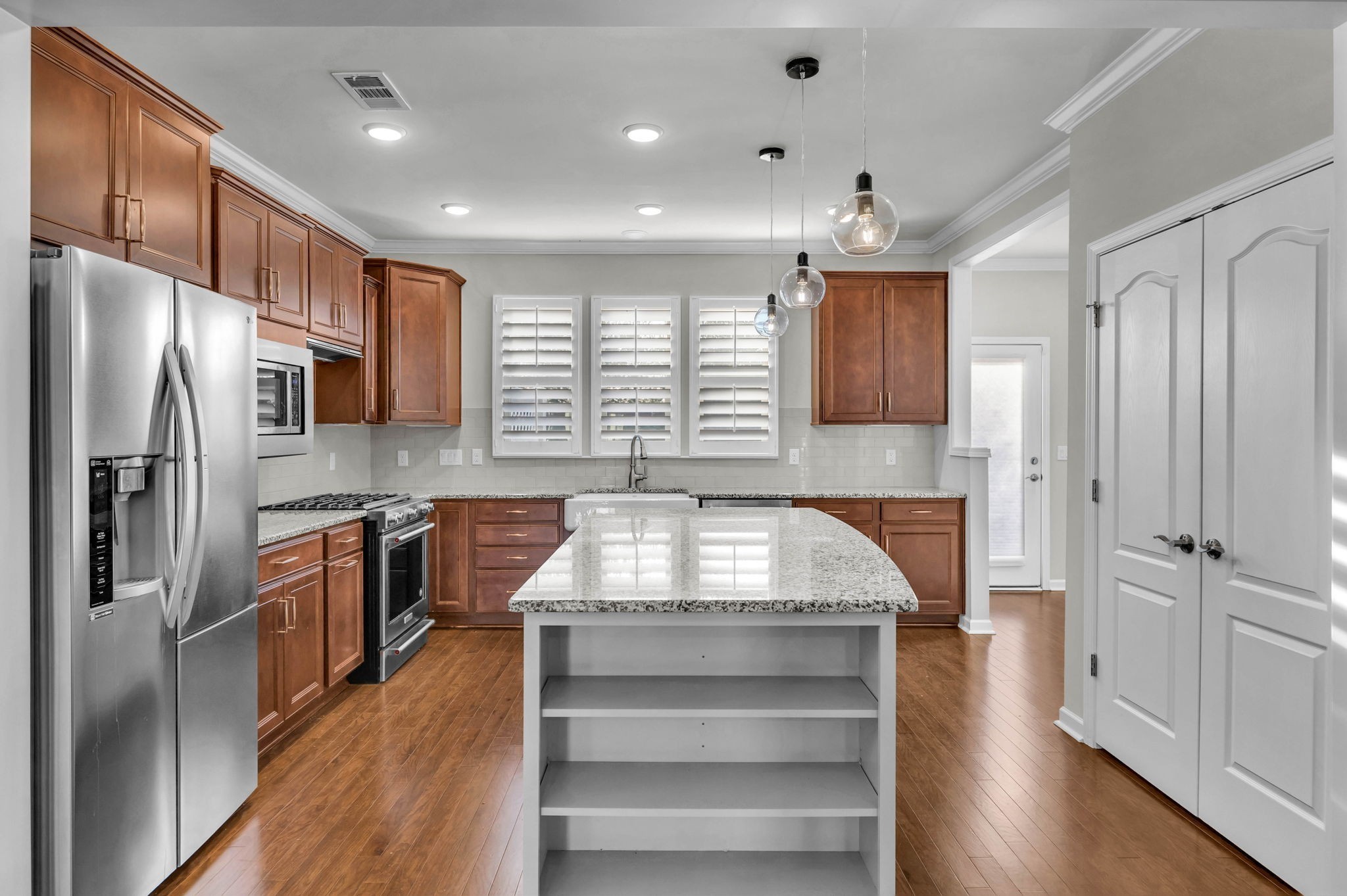 843 Clay Place Spring Hill, TN 37174 - Photo 15 of 56 a kitchen with kitchen island a counter top space stainless steel appliances and a window