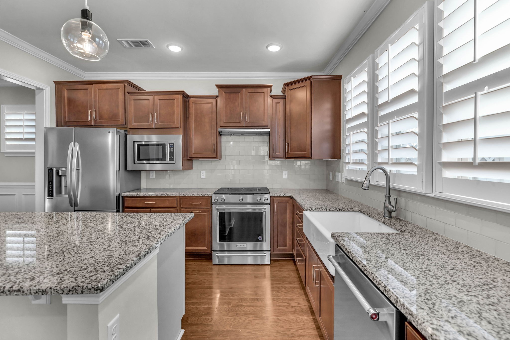 843 Clay Place Spring Hill, TN 37174 - Photo 20 of 56 a kitchen with stainless steel appliances granite countertop a sink stove and refrigerator