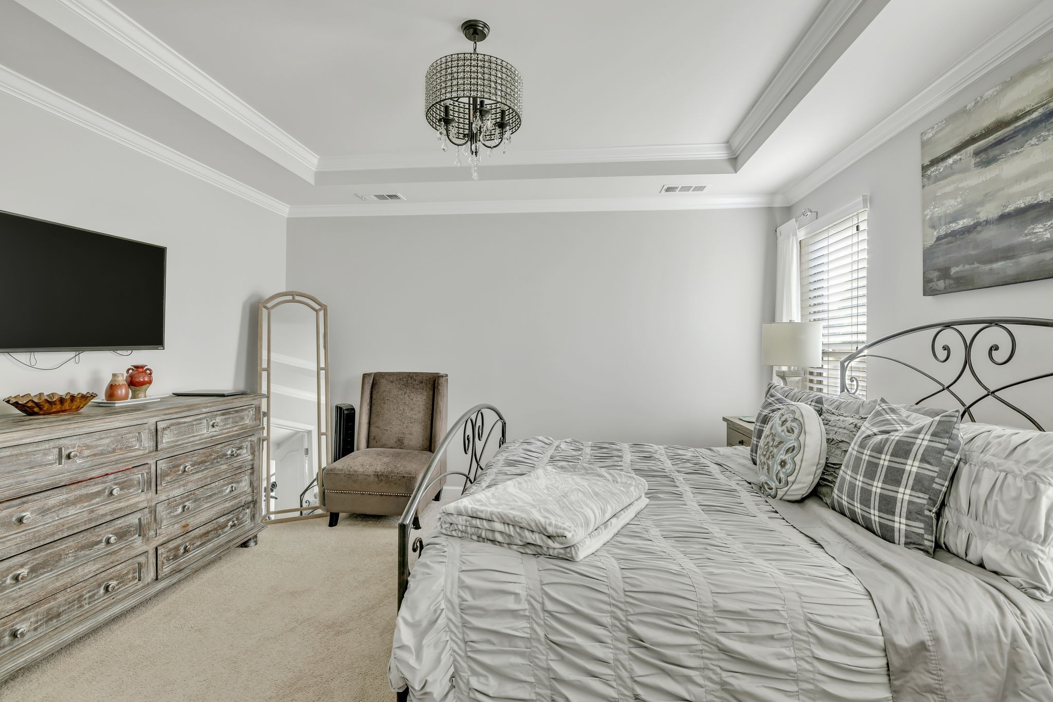 843 Clay Place Spring Hill, TN 37174 - Photo 30 of 56 a bedroom with a bed and flat screen tv