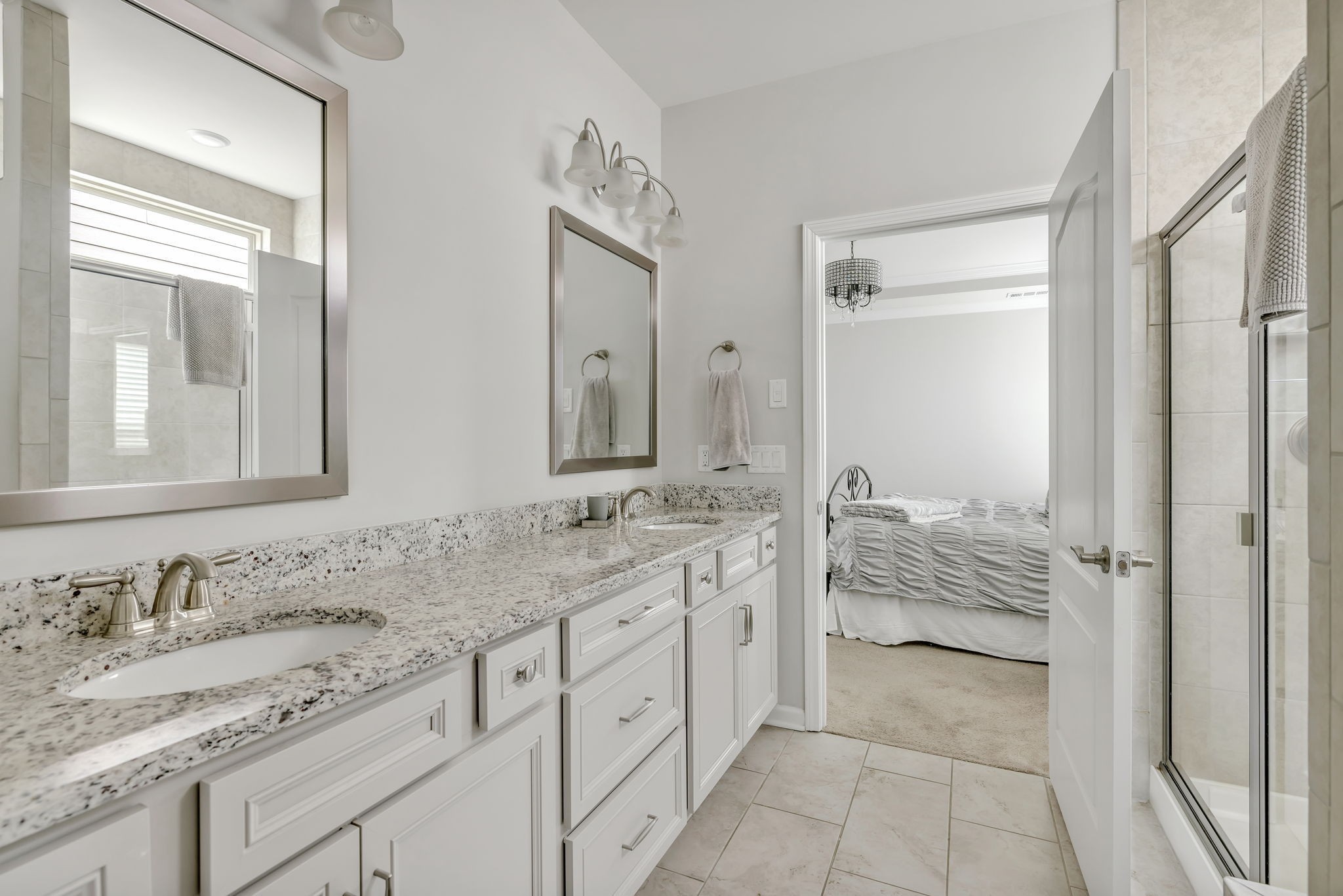 843 Clay Place Spring Hill, TN 37174 - Photo 50 of 56 a spacious bathroom with a granite countertop sink and a mirror