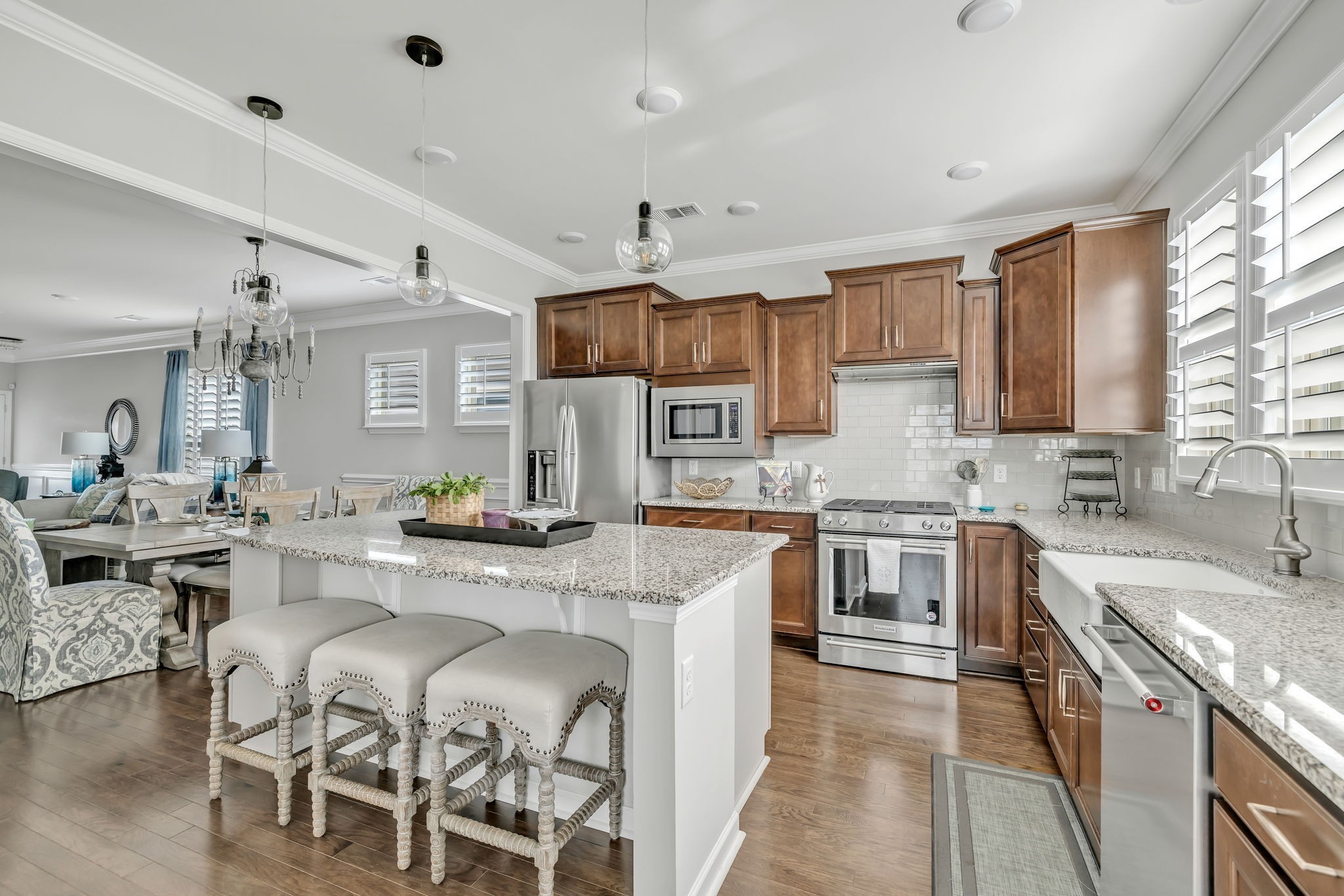 843 Clay Place Spring Hill, TN 37174 - Photo 7 of 56 a kitchen with stainless steel appliances granite countertop a sink stove and refrigerator