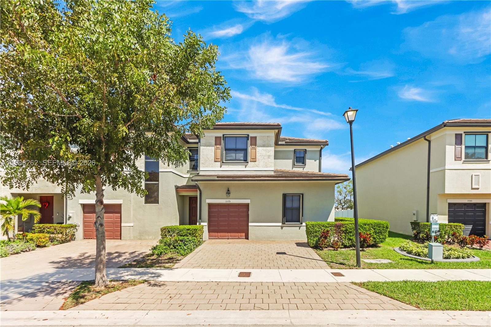3375 West 100th Terrace Hialeah, FL 33018 - Photo 1 of 27 a front view of a house with a yard
