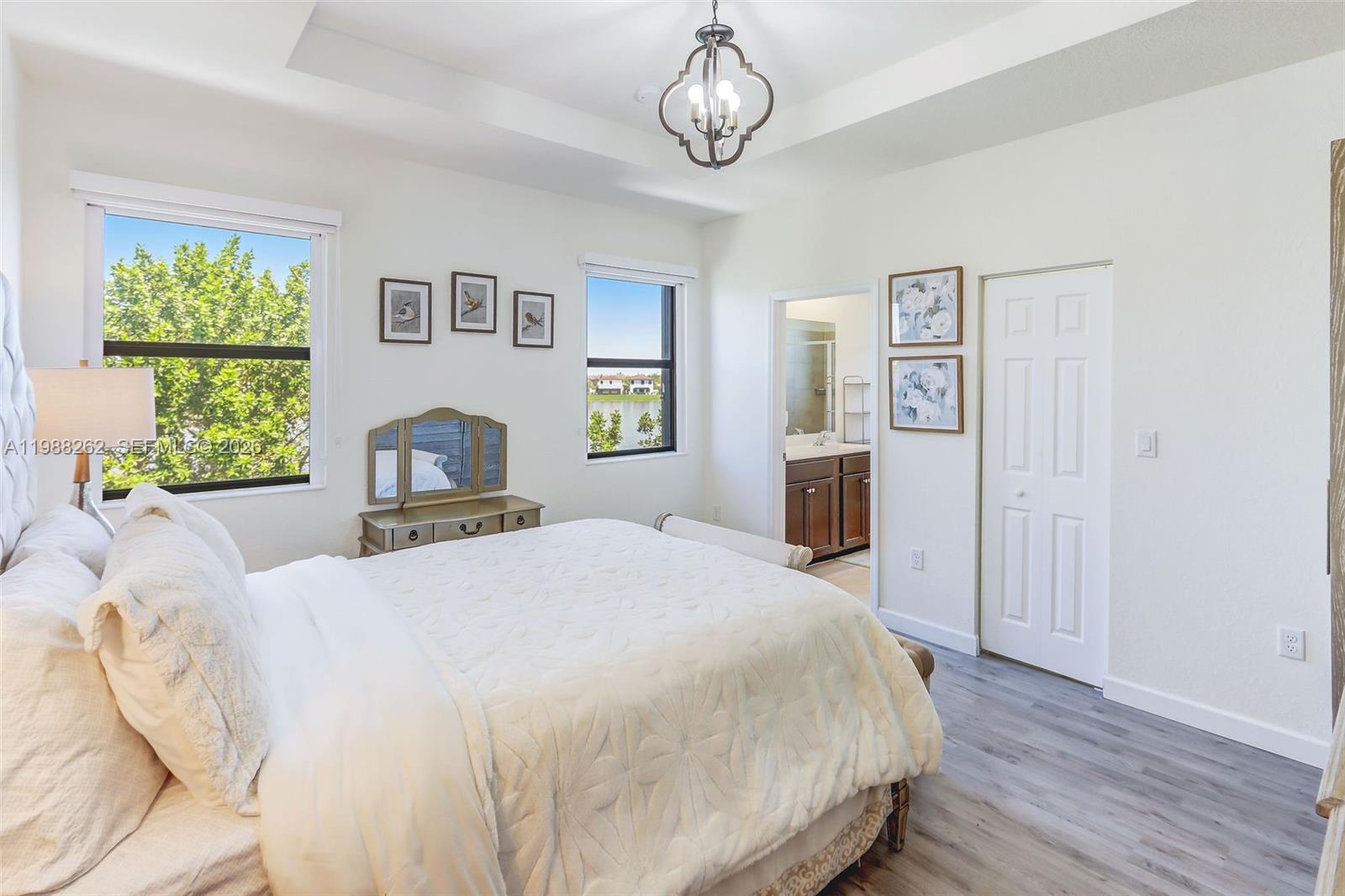 3375 West 100th Terrace Hialeah, FL 33018 - Photo 13 of 27 a bedroom with a large bed and a window