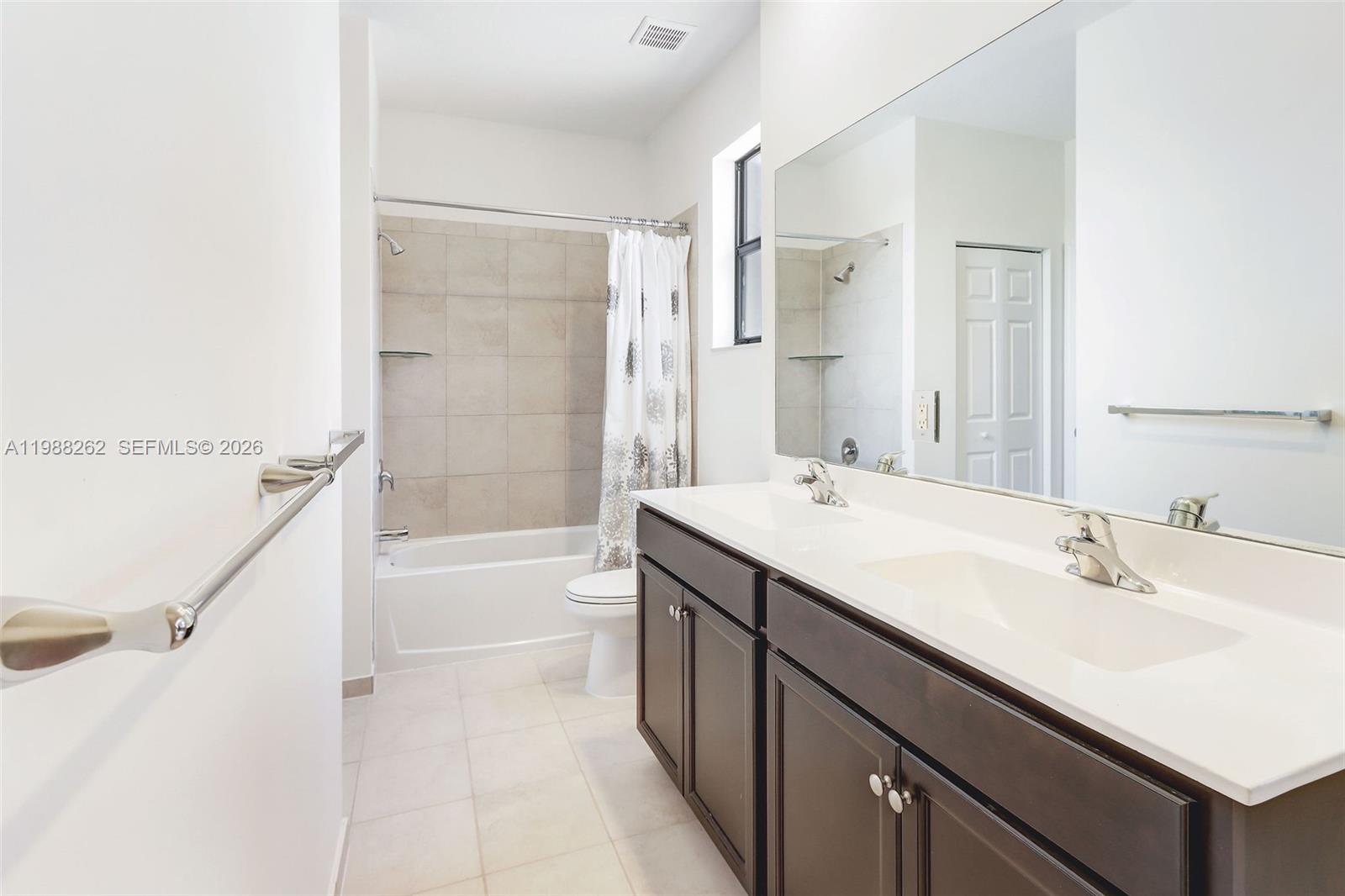 3375 West 100th Terrace Hialeah, FL 33018 - Photo 18 of 27 a bathroom with a tub sink shower and mirror