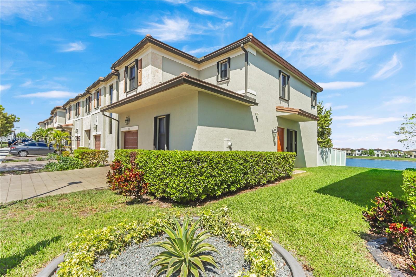 3375 West 100th Terrace Hialeah, FL 33018 - Photo 2 of 27 a front view of a house with a yard