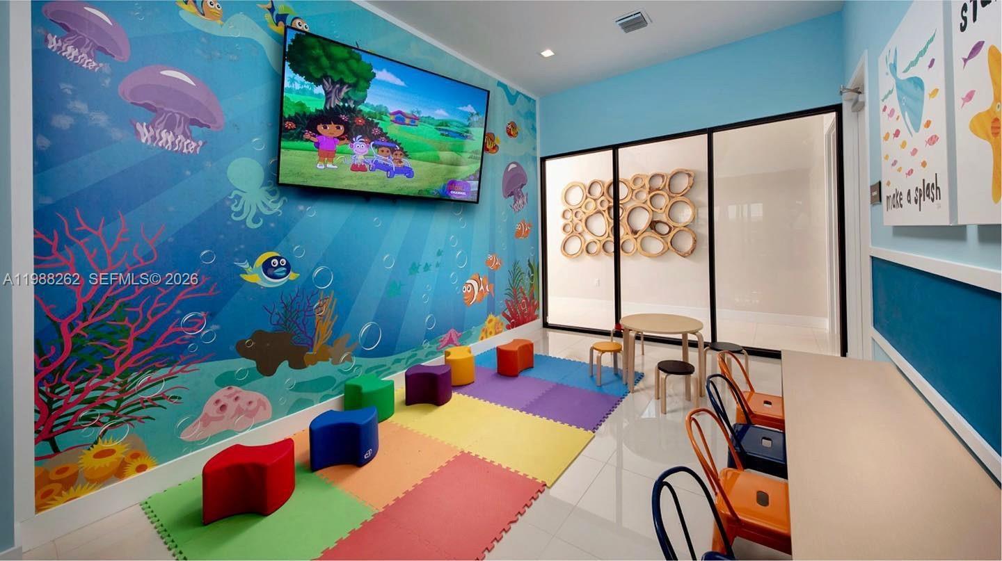 3375 West 100th Terrace Hialeah, FL 33018 - Photo 26 of 27 a room with musical instruments and air hockey table