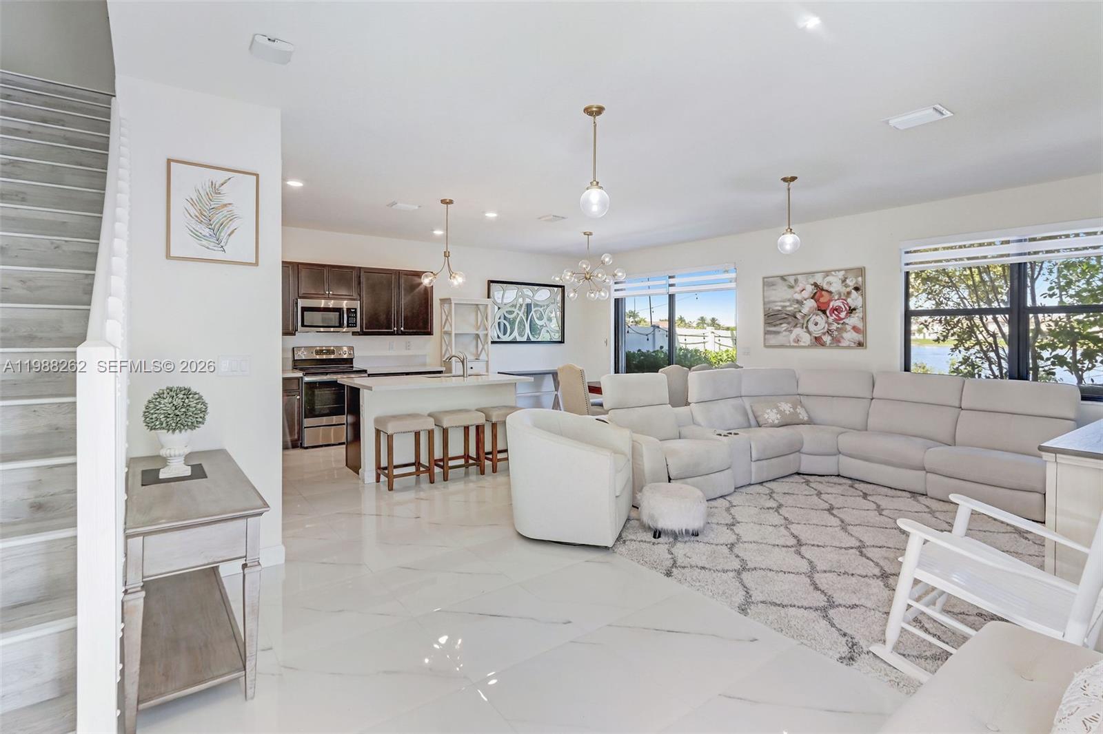 3375 West 100th Terrace Hialeah, FL 33018 - Photo 3 of 27 a living room with furniture and a table