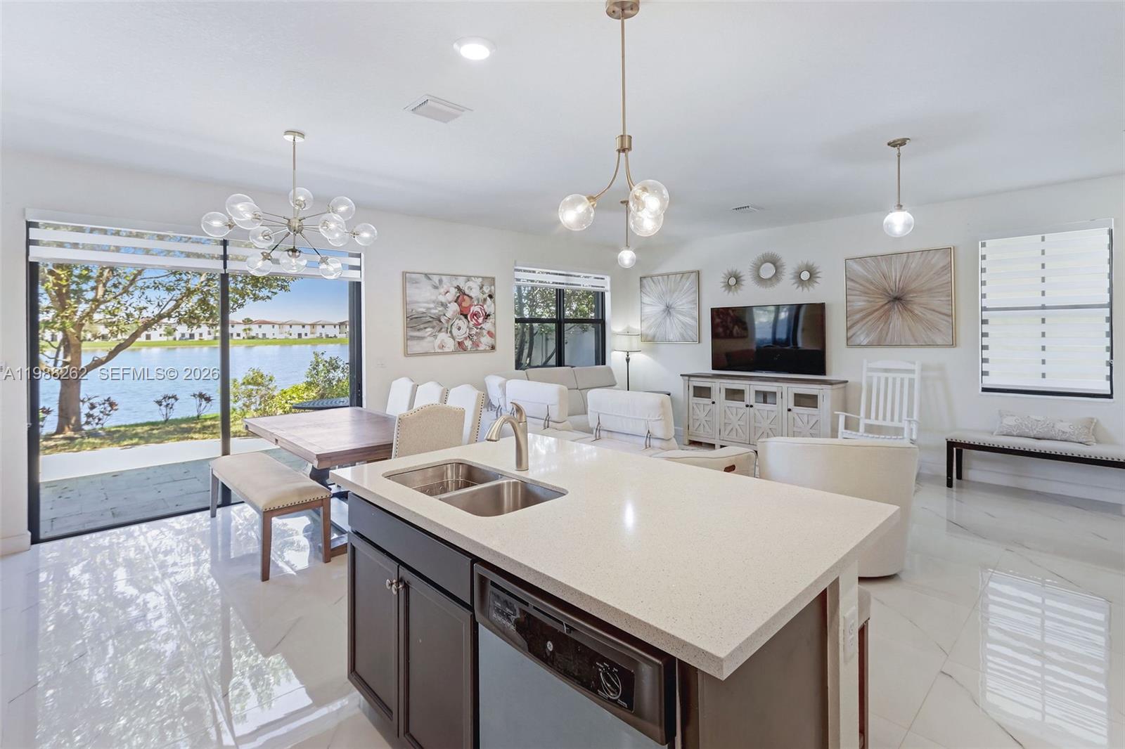 3375 West 100th Terrace Hialeah, FL 33018 - Photo 5 of 27 a kitchen with a sink a counter top space and appliances