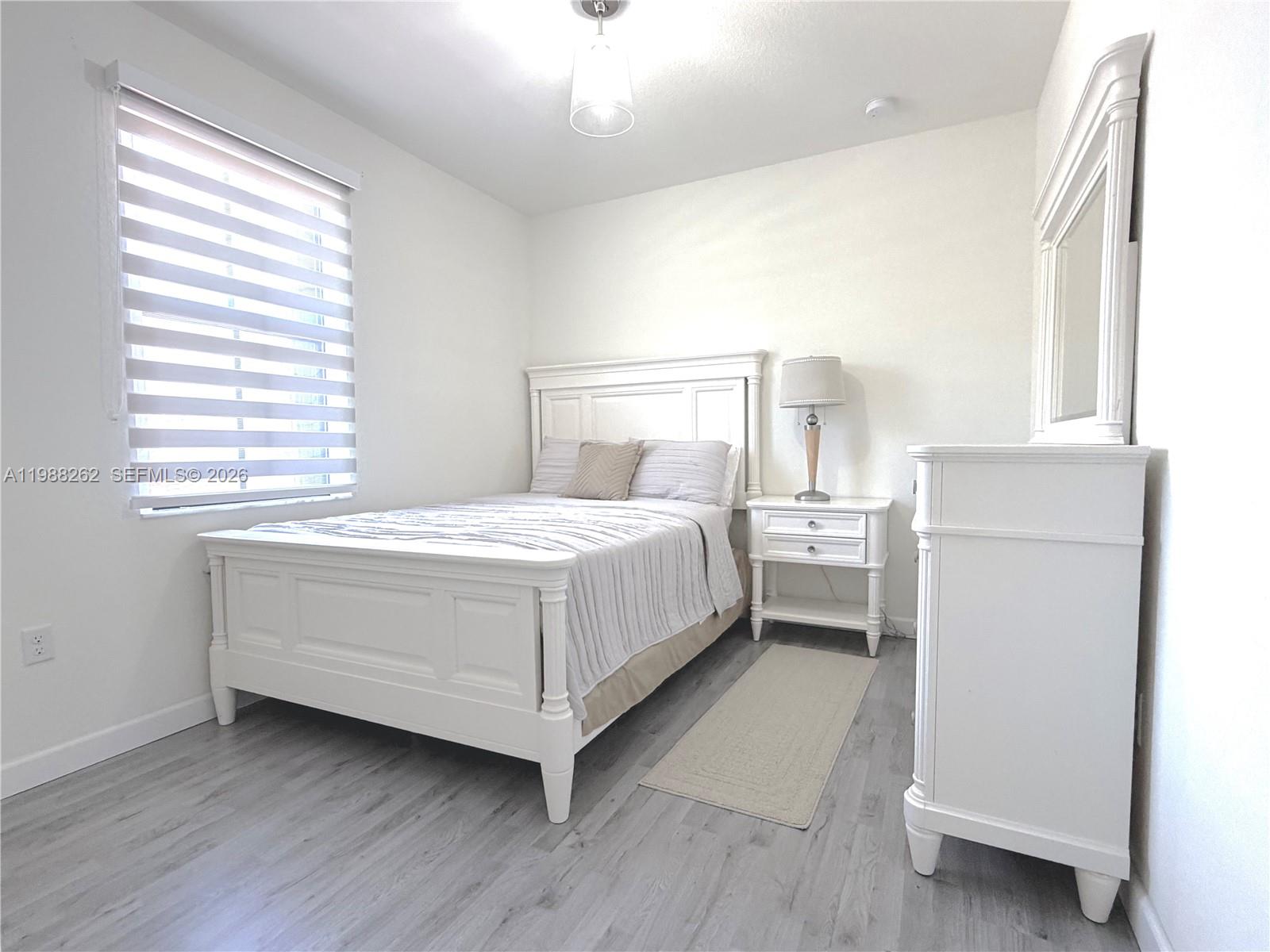 3375 West 100th Terrace Hialeah, FL 33018 - Photo 9 of 27 a room with a bed and a window