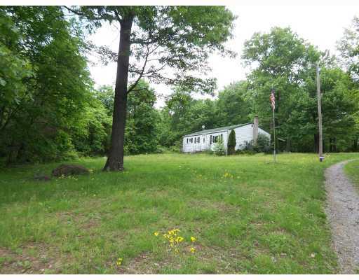 167 Byron Center Road Emlenton, PA 16373 - Photo 2 of 11 Exterior Front. House sits back from road and is surrounded by trees.