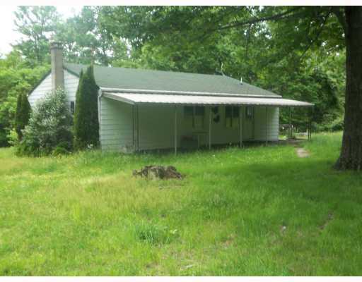 167 Byron Center Road Emlenton, PA 16373 - Photo 3 of 11 Exterior Back. Awning in back of house. Patio for sitting , relaxing and enjoying nature
