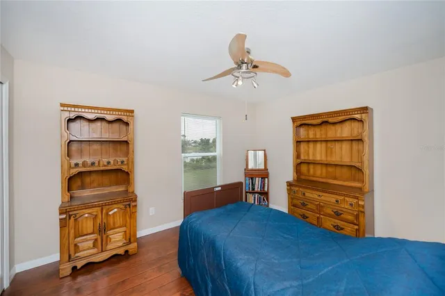 a front view of a house with a garden and yard