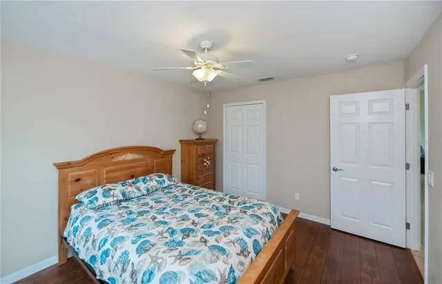 an aerial view of residential houses with outdoor space and lake view