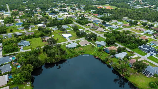 a dining room with furniture a window and a chandelier