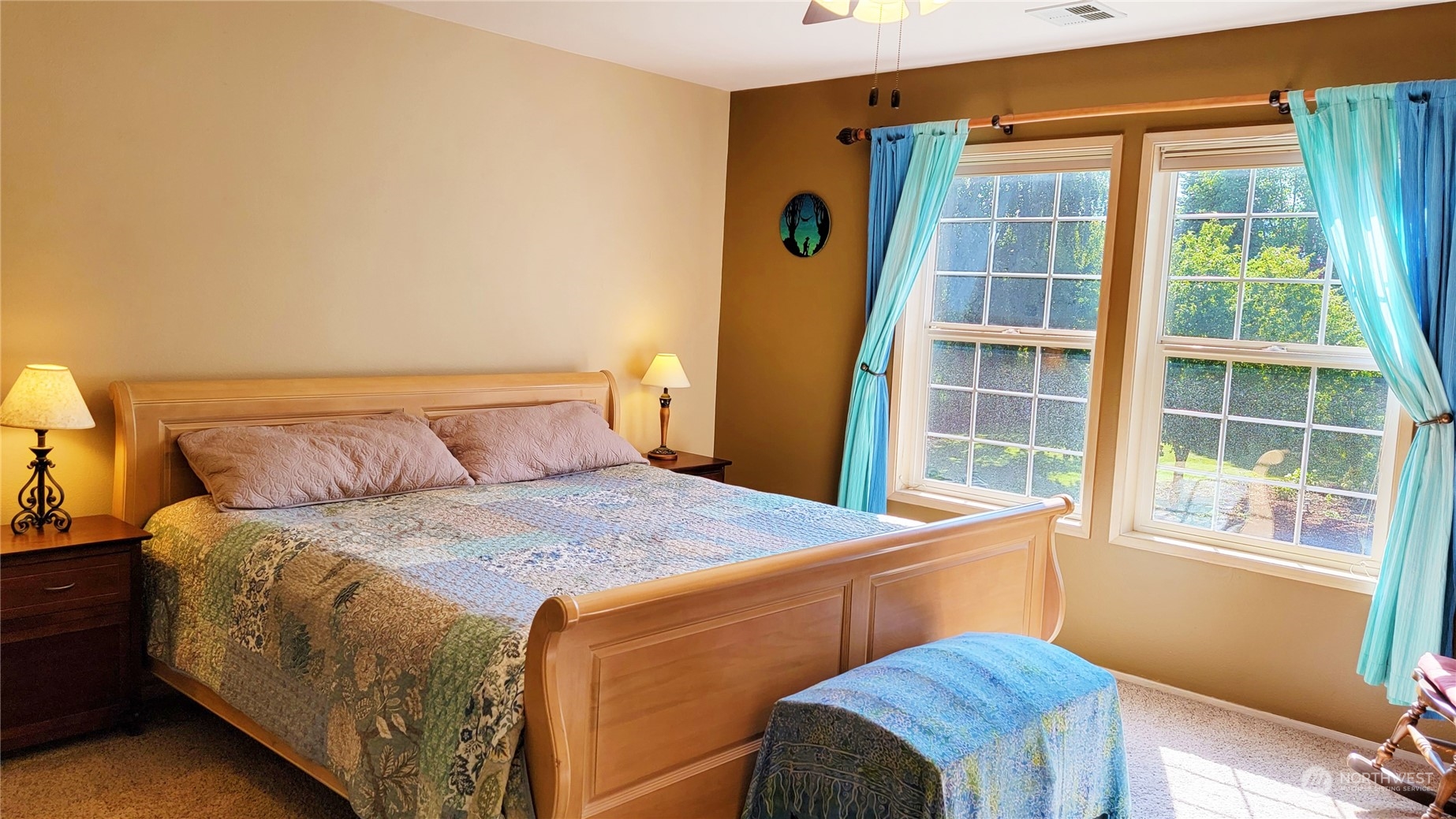 82 Stone Road Sequim, WA 98382 - Photo 17 of 40 a bedroom with a bed and a window