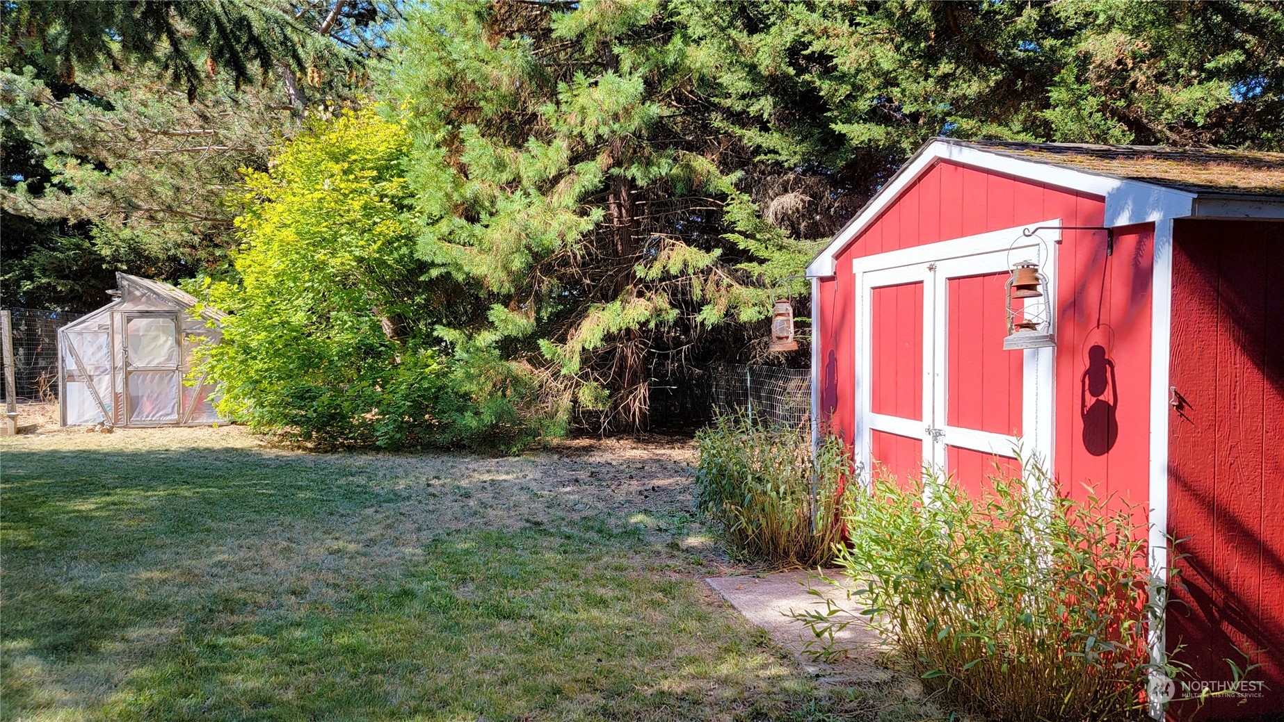 82 Stone Road Sequim, WA 98382 - Photo 32 of 40 a house with trees in front of it