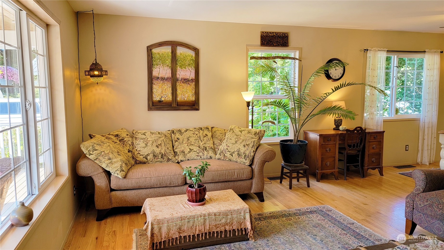 82 Stone Road Sequim, WA 98382 - Photo 10 of 40 a living room with furniture fireplace and a large window
