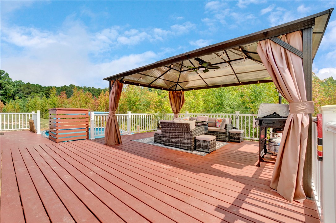 2655 State Rd S-4-108 Anderson, SC 29624 - Photo 26 of 37 An expansive wooden deck features a large covered gazebo perfect for outdoor entertaining.