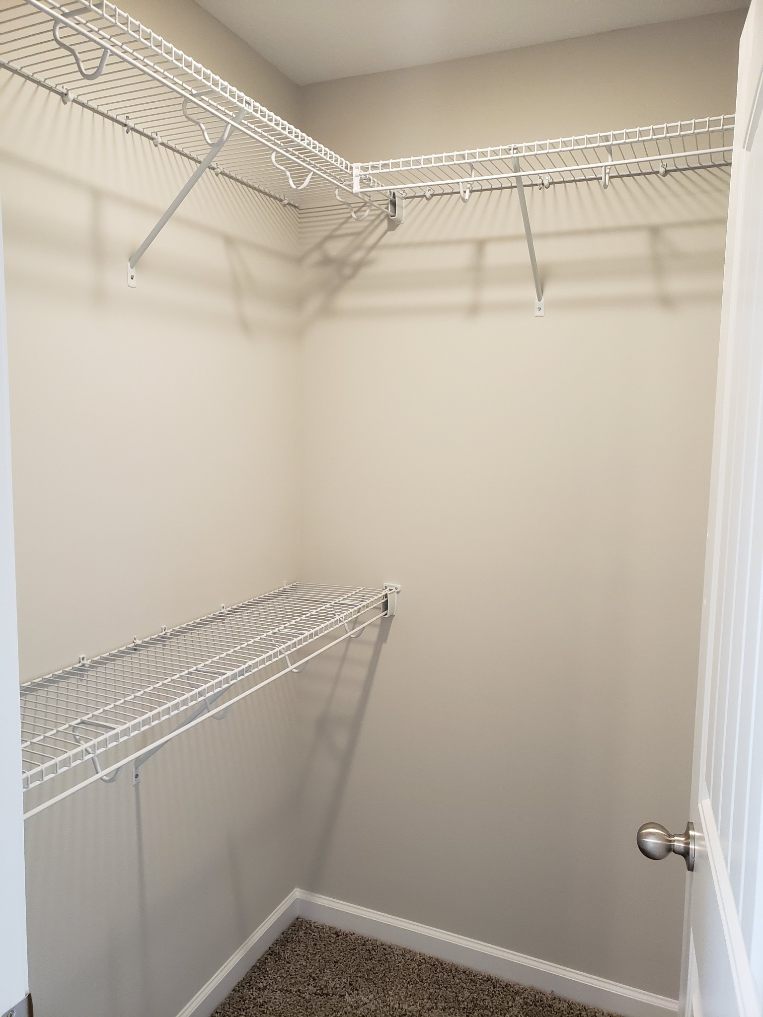 610 Commerce Street, Unit 24 Clarksville, TN 37040 - Photo 15 of 18 a view of a room with racks on the wall