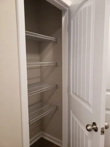 a empty closet with white paint